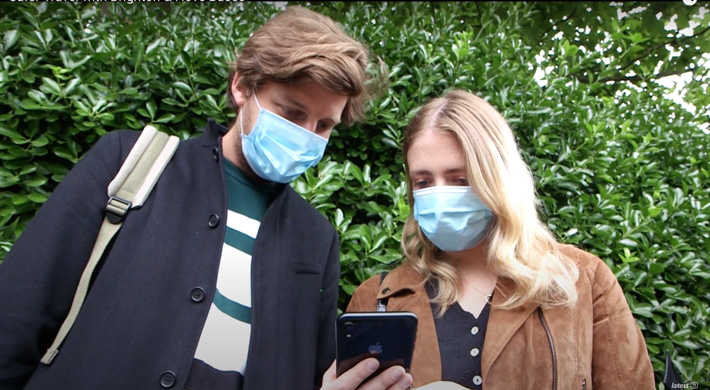 Two people looking at phone
