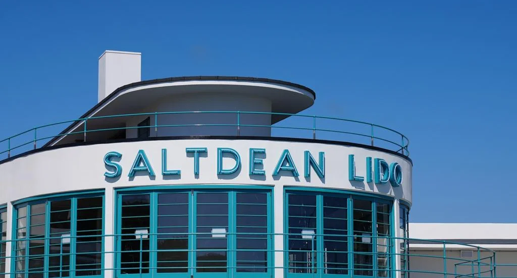 Front of the Saltdean Lido building with blue skies