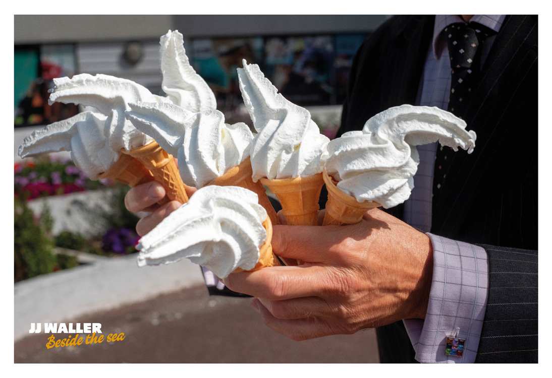 Someone holding lots of ice cream