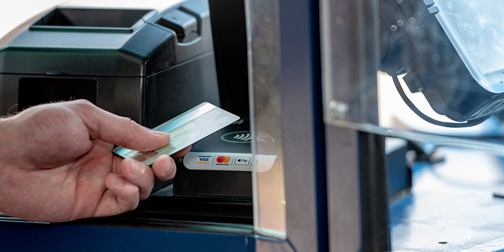 A contactless card tapped on bus