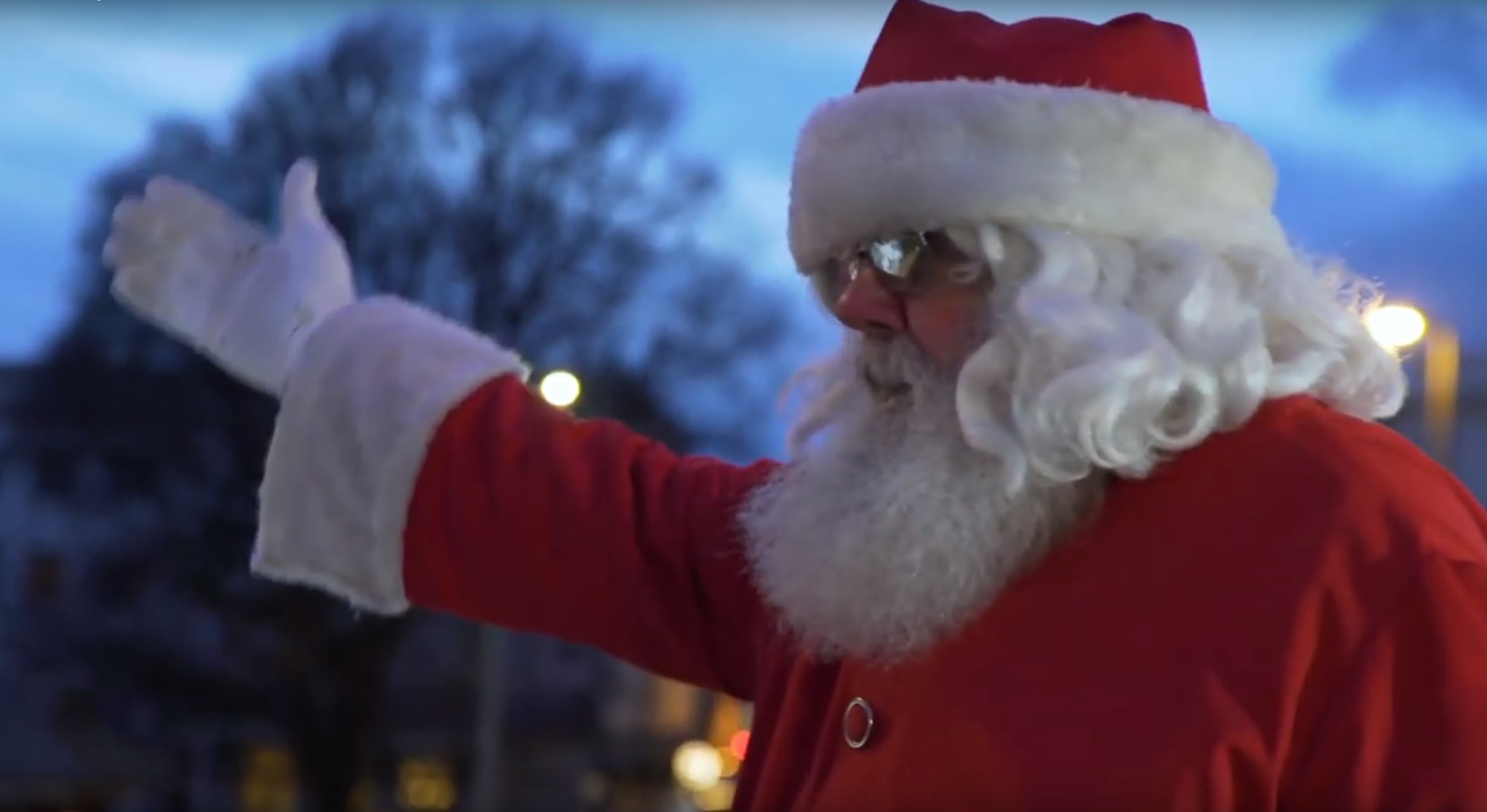 Santa Mike waving from the Santa Bus