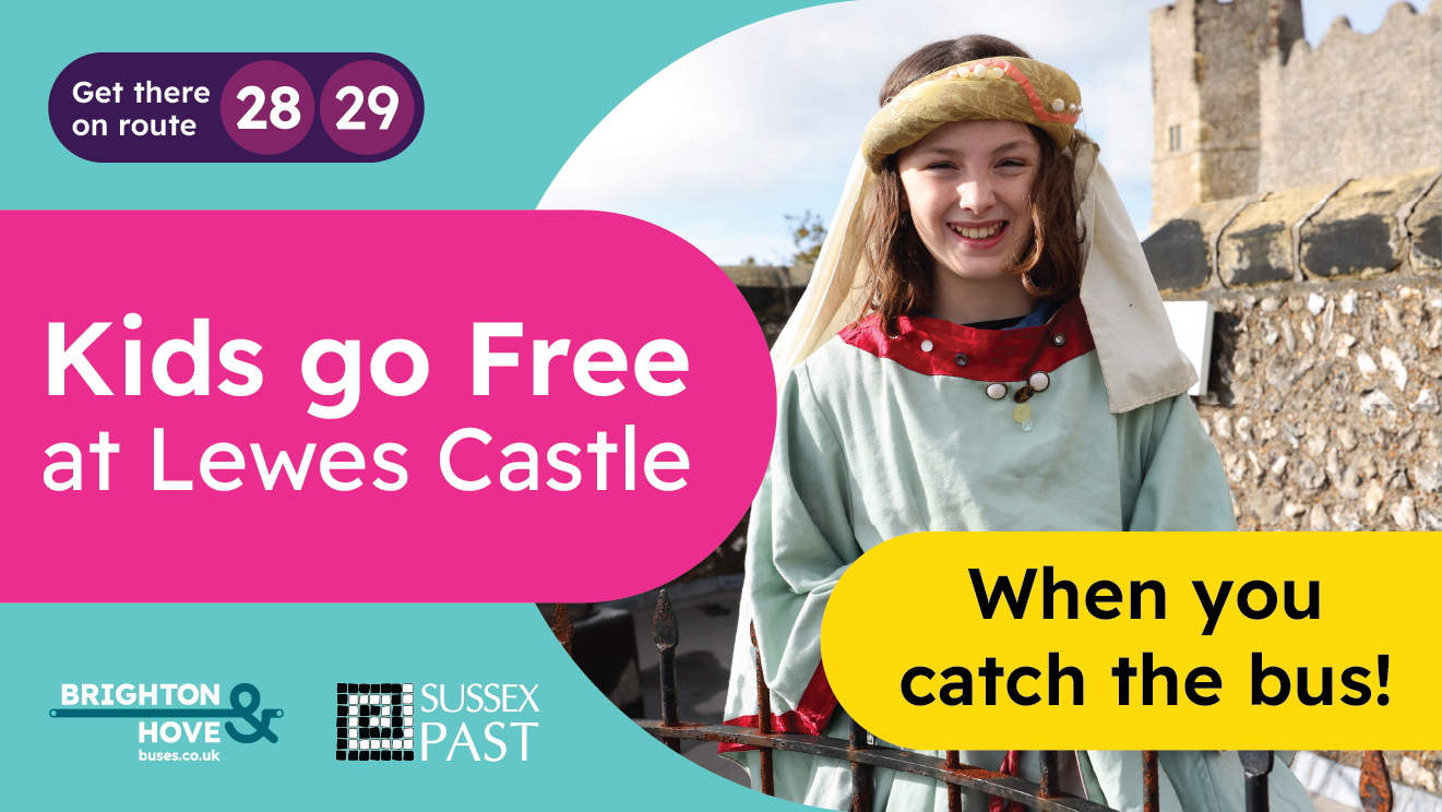 Child smiling in historical clothing outside Lewes Castle