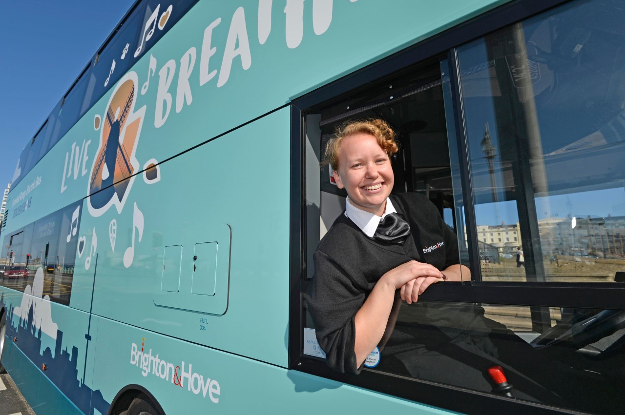 Bus and driver with Live & Breathe design on side